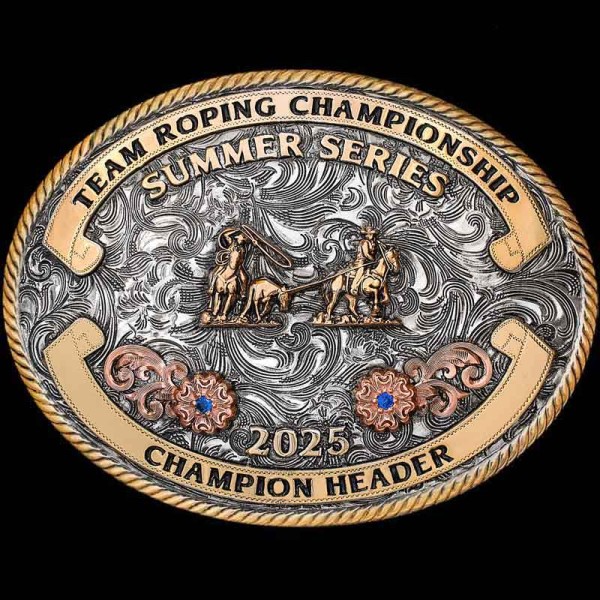 "Team Ropers will be Head over Heel-er for this stunning Trophy Buckle! Our Aledo Classic is crafted on a German Silver base with an antique finish. It is detailed with many elements to add character & color such as a Jeweler's Bronze rope edge, 